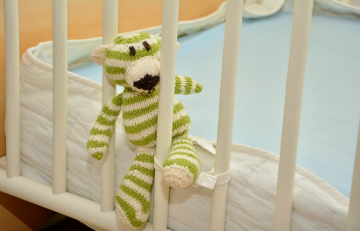baby toy in between bed rails