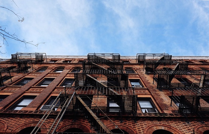 upwards view of a brownstone block