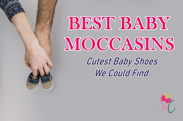 Mom and dad holding baby moccasins mc